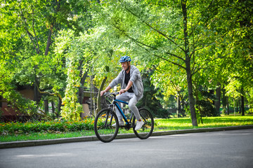 Fototapeta premium Mature sporty man riding bicycle outdoors