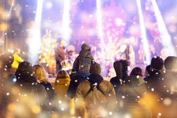 Concert crowd. Winter family event background
