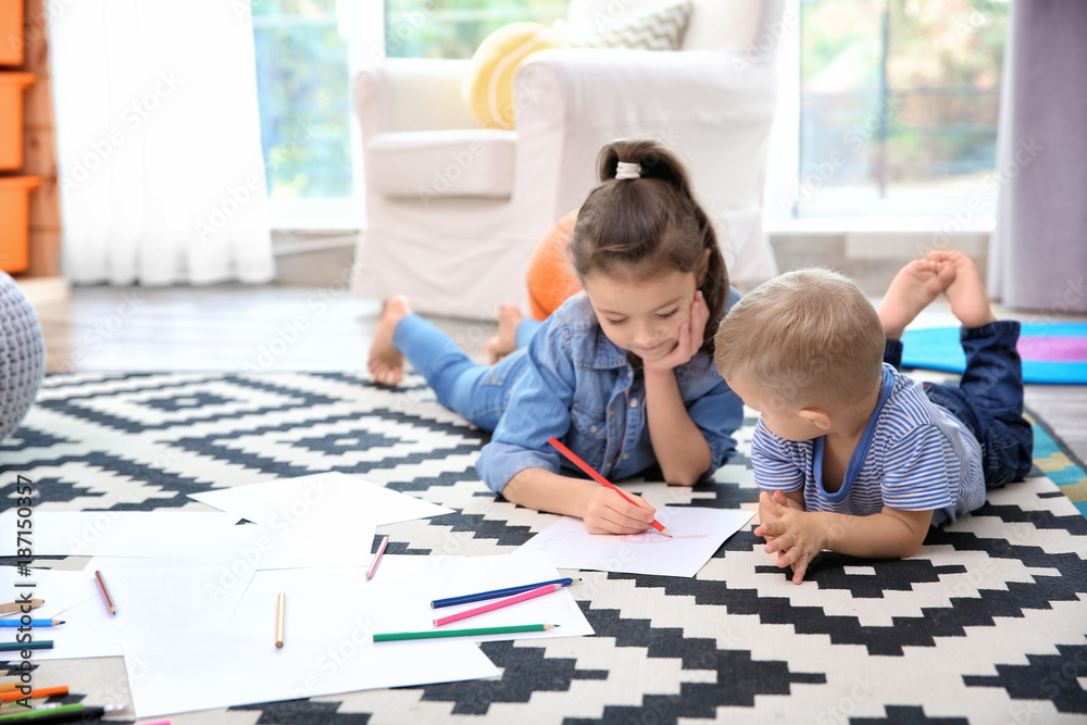 Canvas Prints little girl and boy drawing on floor at home