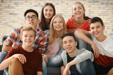 Group of funny teenagers indoors