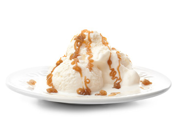 Plate with ice cream and caramel sauce on white background