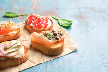 Tasty fresh bruschettas on wooden table