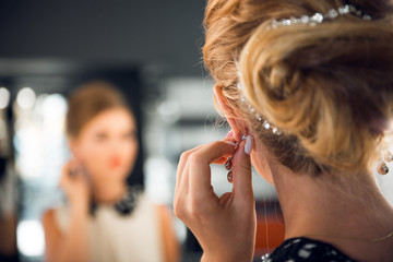 Fototapeta premium bride get a professional hair style at beauty salon