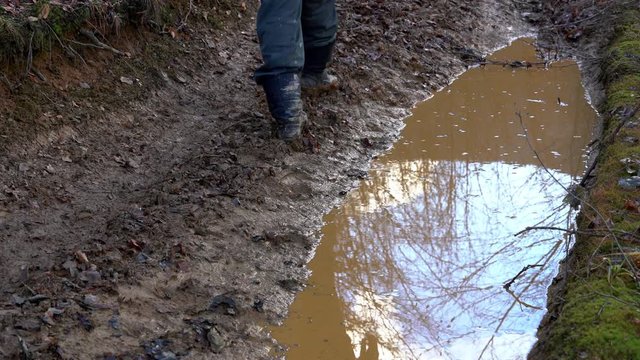 Man goes into the puddle mirror