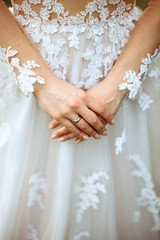 Obraz na płótnie Canvas Bride's hand with white nails