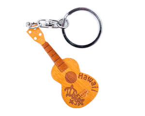 Hawaiian gift, souvenir wooden guitar like key holder isolated on white background