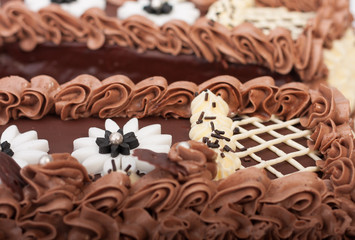 Close up of birthday sponge cake with chocolate cream