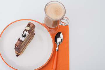 Piece of sponge cake with chocolate cream