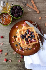 Fototapeta na wymiar Belgian waffles with blueberry and honey