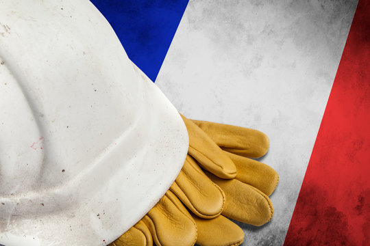 Construction Workers Hard Hat and Gloves on flag of France
