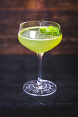 A view of the cocktail in a wine-glass on the table.