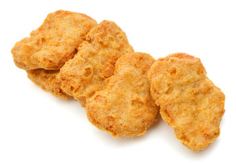 Macro of fried chicken nuggets on white background