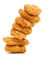 Macro of fried chicken nuggets on white background