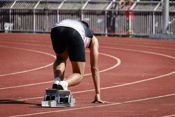 Athlete runner feet running on treadmill closeup on shoe,Students boy get set to leaving the...
