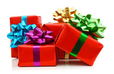 Red gift box with colorful bow isolated on white