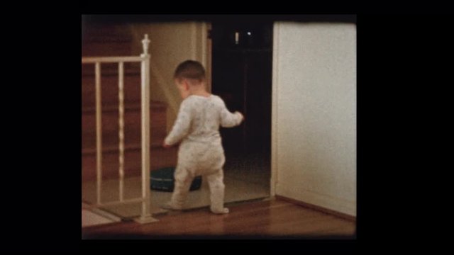 1960 Cute little boy climbs steps