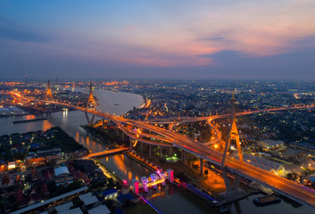 Aerial view of Bangkok Expressway and Highway top view during twilight time ,expressway is an important infrastructure for rush hour in Bangkok ,Thailand.Shot from drone.
