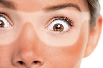 Sunburn tan lines of sunglasses, red painful skin. Scared Asian woman shocked with funny expression...