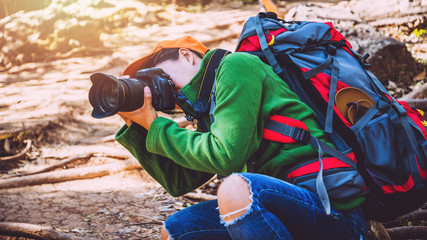 photographer Asian women Traveling photograph Nature. travel relax in the holiday walk in the forest. Thailand