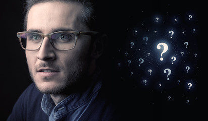 man with many question mark near him