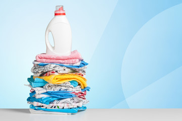 Clean laundry and liquid washing detergent front view