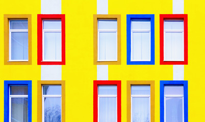 Yellow Wall With Colorful Windows