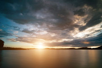Naklejka premium Sunset over lake.