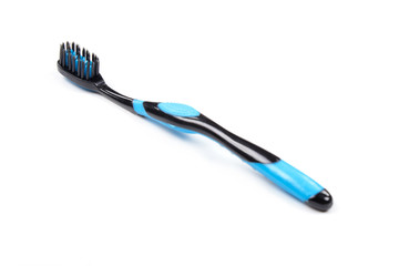 Toothbrush black and blue isolated white background.