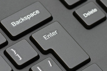 part of a computer keyboard with Enter and Backspace keys