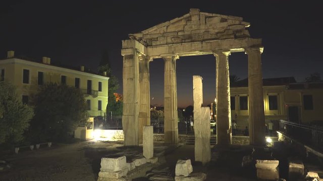 ruins of the ancient roman agora in athens at night