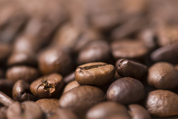 Macro detail of brown roasted natural coffee beans