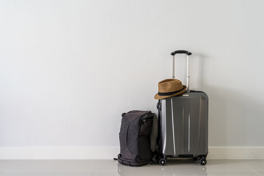 Travel suitcase with backpack and hat