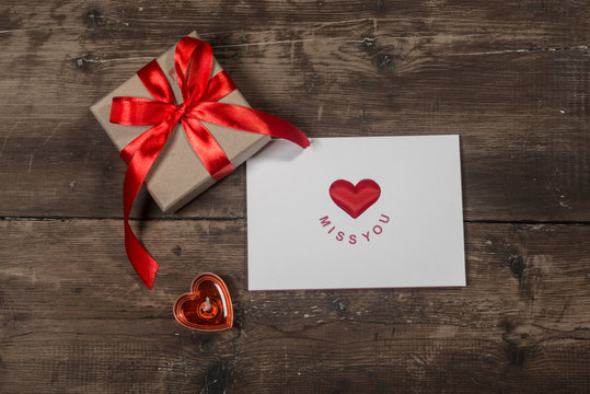 Valentines day card and gift on the old wooden board
