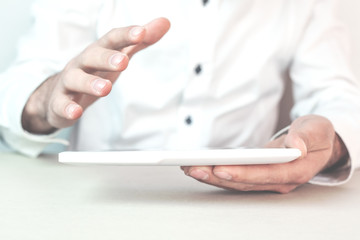 Man holding digital tablet.