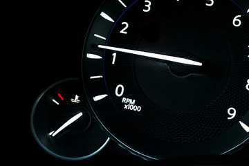 Fototapeta premium Car instrument panel, dashboard closeup with visible speedometer and fuel level. Modern steering wheel. Modern car interior details