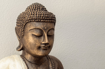 Siddhartha bronze statue. Close up of Buddha beautiful serene face with closed eyes. Best...