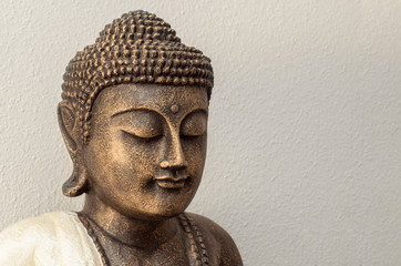 Siddhartha bronze statue. Close up of Buddha beautiful serene face with closed eyes. Best meditation inspiration image or mindfulness background.Copy space.