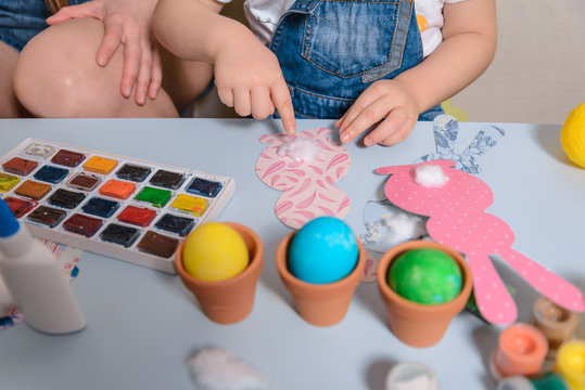 mother with kid making eater bunny