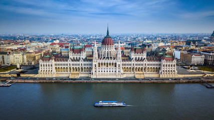 Fototapeta na wymiar Budapest, Hungary - Aerial skyline view of the Parliament of Hungary with sightseeing boat on River Danube