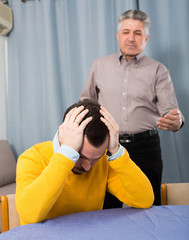 Adult father teaches his son