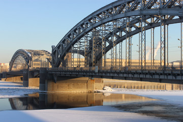 The Bridge of Peter the Great Russia, Saint Petersburg. Neva River. Bridge of Peter the Great in the winter at sunset