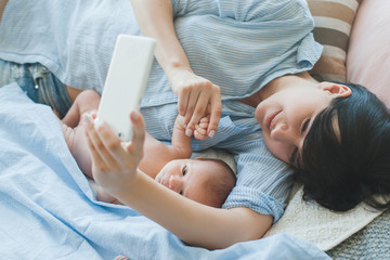 family communication chat smartphone newborn concept. say 'hi' to daddy. family online conversation. together despite the distance