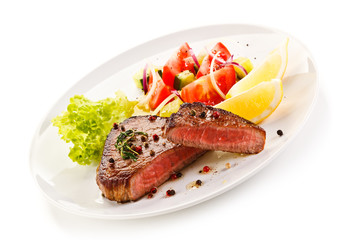 Grilled steaks and vegetables