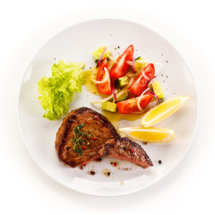 Grilled steaks and vegetables