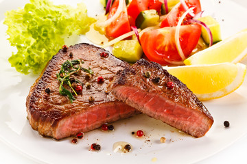 Grilled steaks and vegetables