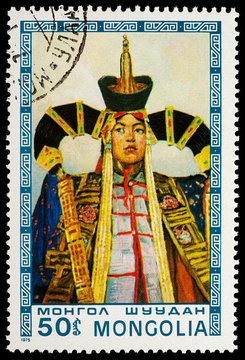 Mongolian woman in traditional costume on postage stamp