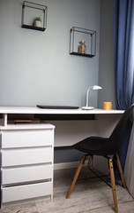 Comfortable workplace with laptop in home