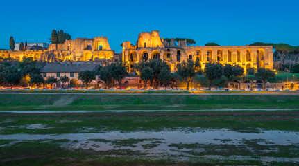 The Circo Massimo and the Palatine Hill ruins illuminated at sunset, in Rome, Italy.