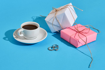 Valentine's day greeting card. White coffee cup and gift boxes o