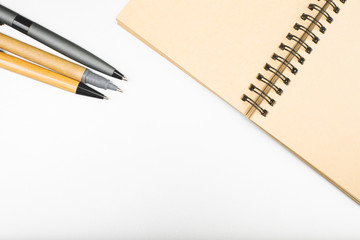 Office desktop with empty notebook